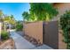 Private gated entry to condo with paved walkway and landscaping at 1136 N 84Th Pl, Scottsdale, AZ 85257