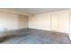 Empty garage interior with concrete floor and single door at 1136 N 84Th Pl, Scottsdale, AZ 85257