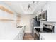 Updated kitchen with white shaker cabinets and stainless steel appliances at 1136 N 84Th Pl, Scottsdale, AZ 85257