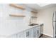 Updated kitchen with white shaker cabinets and stainless steel appliances at 1136 N 84Th Pl, Scottsdale, AZ 85257