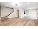 Open living area with wood-look floors and a view of the kitchen at 1136 N 84Th Pl, Scottsdale, AZ 85257