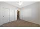 Spacious bedroom featuring double door closet and ceiling fan at 12391 W Tonto St, Avondale, AZ 85323