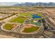 Community features sports fields, a lake, playground, and walking paths at 12531 W Parkway Ln, Avondale, AZ 85323