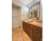 Updated bathroom with a vessel sink, wood cabinets, and large mirror at 16041 N 31St St # 16, Phoenix, AZ 85032