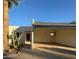 Desert landscaping surrounds this charming light-colored home with carport at 16041 N 31St St # 16, Phoenix, AZ 85032