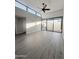 Bright living room with hardwood floors and sliding glass doors at 16041 N 31St St # 16, Phoenix, AZ 85032