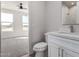 Clean bathroom with white vanity, toilet and walk-in shower at 16320 E Skinner Dr, Scottsdale, AZ 85262