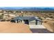 Single-story house, two-car garage, mountain backdrop at 16348 E Skinner Dr, Scottsdale, AZ 85262