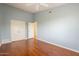 Serene bedroom with light blue walls and wood floors at 16804 E Monterey Dr, Fountain Hills, AZ 85268