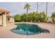 Relaxing kidney-shaped pool with a large patio and lush landscaping at 16804 E Monterey Dr, Fountain Hills, AZ 85268