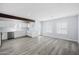 Open living room with wood-look floors and light walls at 1718 E Glenrosa Ave, Phoenix, AZ 85016