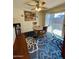 Cozy dining area with a wooden table, chairs, and a ceiling fan at 1831 E Kirkland Ln # B, Tempe, AZ 85281