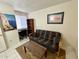 Small office space with a futon, desk, and bookshelf at 1831 E Kirkland Ln # B, Tempe, AZ 85281