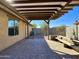 Pergola-covered patio, AC unit, and a stone bench at 19622 W Morning Glory St, Buckeye, AZ 85326