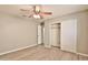 Bedroom with ceiling fan and large closet at 2332 W Roy Rogers Rd, Phoenix, AZ 85085