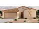 Single-story home with a two-car garage and desert landscaping at 24604 W Hopi St, Buckeye, AZ 85326