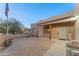 Brick paved entryway with covered porch and desert landscaping at 24916 W Red Robin Dr, Wittmann, AZ 85361