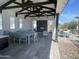 Covered patio with fireplace and dining area at 2541 E Music Mountain Ave, Apache Junction, AZ 85119