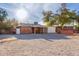 Large backyard with gravel and a view of the house at 2726 W Lawrence Rd, Phoenix, AZ 85017