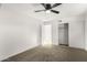 Bright bedroom with ceiling fan, carpet, and spacious closet at 2726 W Lawrence Rd, Phoenix, AZ 85017