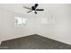 Bright bedroom with ceiling fan and large window at 2726 W Lawrence Rd, Phoenix, AZ 85017