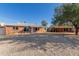 Ranch-style brick home with a spacious front yard and updated entryway at 2726 W Lawrence Rd, Phoenix, AZ 85017