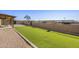 Artificial turf backyard with covered patio at 3165 W Foothill St, Apache Junction, AZ 85120