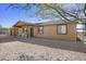 Single-story house with a covered porch and gravel driveway at 3165 W Foothill St, Apache Junction, AZ 85120