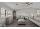 Living room with grey couches, wood-look tile floors, and a view at 3165 W Foothill St, Apache Junction, AZ 85120