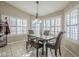 Bright breakfast nook with wood table and chairs at 3223 E Cedarwood Ln, Phoenix, AZ 85048