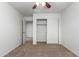 Bedroom with carpet, ceiling fan and sliding door closet at 3717 S 54Th Ln, Phoenix, AZ 85043