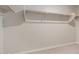 Walk-in closet with double hanging rods and neutral walls at 3815 S 54Th Ln, Phoenix, AZ 85043