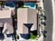 An aerial view of a house with a pool in a residential area at 3917 E Dubois Ave, Gilbert, AZ 85298