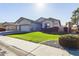 Single-story home with a two-car garage and well-maintained landscaping at 3917 E Dubois Ave, Gilbert, AZ 85298