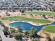 Aerial view of a golf course with a water feature at 3917 E Dubois Ave, Gilbert, AZ 85298