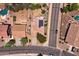 An aerial view of a house with solar panels and a backyard at 44182 W Juniper Ave, Maricopa, AZ 85138