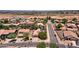 Aerial view of a residential neighborhood with houses and streets at 44182 W Juniper Ave, Maricopa, AZ 85138