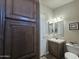 Bathroom with a sink, toilet, and built-in cabinets at 650 N Hawes Rd # 4101, Mesa, AZ 85207