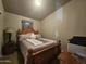 Cozy bedroom with a wooden bed frame and a printer at 650 N Hawes Rd # 4101, Mesa, AZ 85207