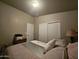 Primary bedroom with a king-size bed and double door closet at 650 N Hawes Rd # 4101, Mesa, AZ 85207