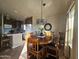 Dining area with wood table and chairs, adjacent to kitchen at 650 N Hawes Rd # 4101, Mesa, AZ 85207