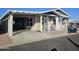 Home exterior with carport, patio, and golf cart at 650 N Hawes Rd # 4101, Mesa, AZ 85207