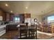 Spacious kitchen with island, dark wood cabinets, and tile floor at 650 N Hawes Rd # 4101, Mesa, AZ 85207