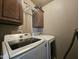 Laundry room with Samsung washer and dryer and upper cabinets at 650 N Hawes Rd # 4101, Mesa, AZ 85207