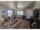 Spacious living room featuring a ceiling fan and comfortable furniture at 650 N Hawes Rd # 4101, Mesa, AZ 85207