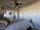 Main bedroom with king bed, ceiling fan and access to bathroom at 650 N Hawes Rd # 4101, Mesa, AZ 85207