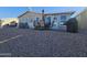Patio with seating area and grill, overlooking gravel yard at 650 N Hawes Rd # 4101, Mesa, AZ 85207