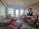Sunroom with wicker furniture, TV, and access to patio at 650 N Hawes Rd # 4101, Mesa, AZ 85207