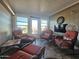 Relaxing sunroom with wicker furniture and tile flooring at 650 N Hawes Rd # 4101, Mesa, AZ 85207