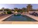 Relaxing rectangular pool surrounded by a brick patio and lounge chairs at 8618 E Santa Catalina Dr, Scottsdale, AZ 85255